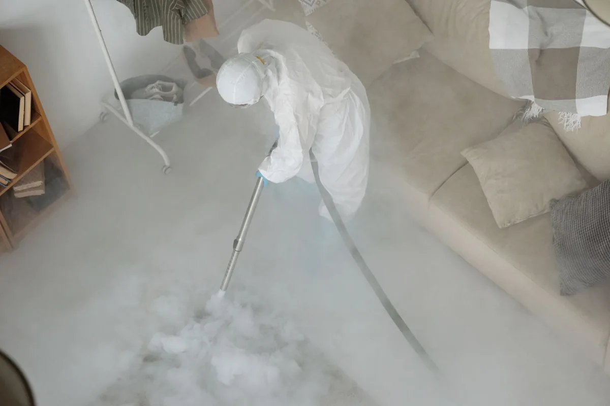 Biohazard cleanup technician in protective equipment, Hahnville, LA